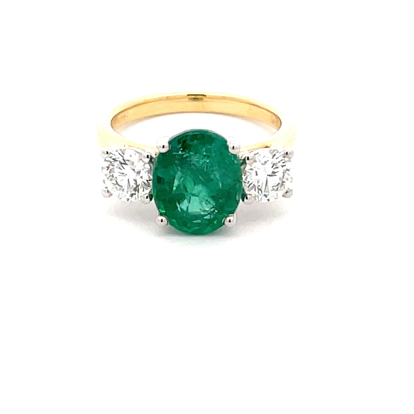 Emerald and round brilliant cut diamond 3 stone ring Gardiner Brothers