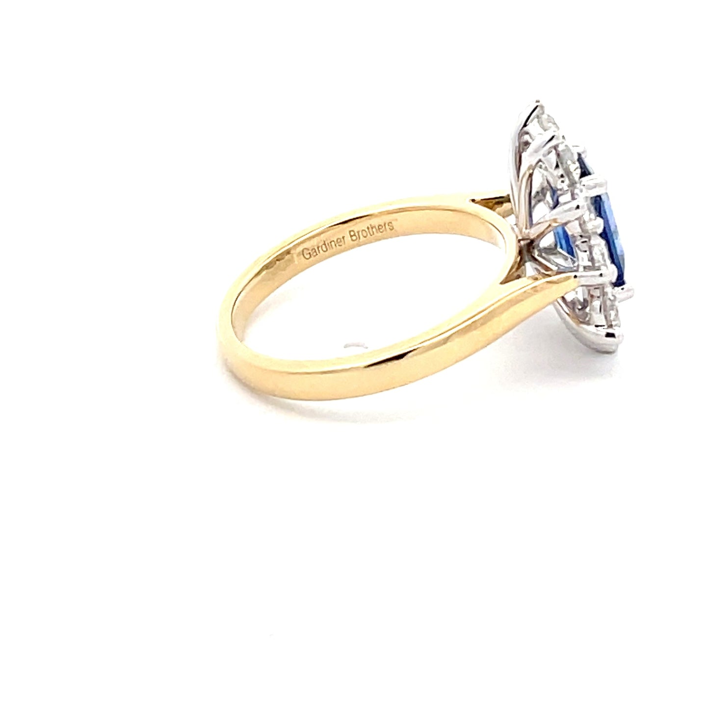 Sapphire and round Brilliant Cut Diamond Cluster Style Ring Gardiner Brothers