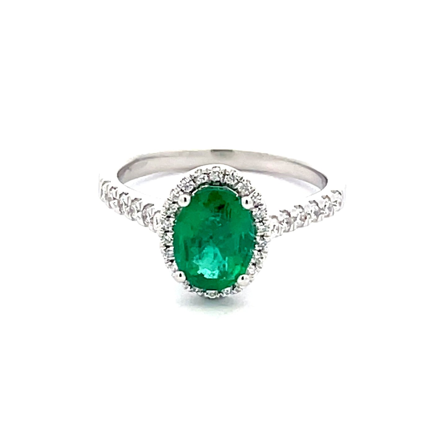 Emerald and round Brilliant Cut diamond halo style ring Gardiner Brothers