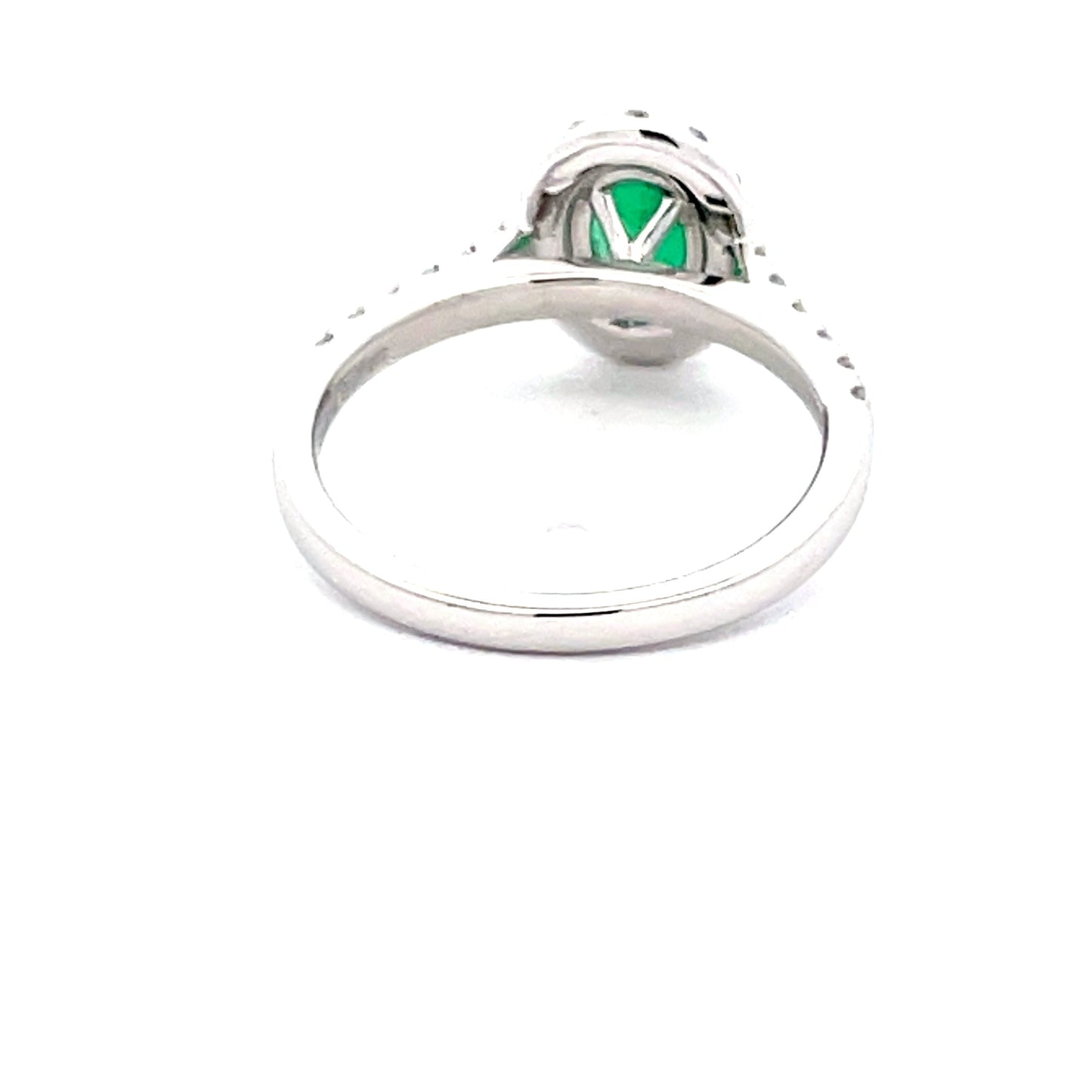 Emerald and round Brilliant Cut diamond halo style ring Gardiner Brothers