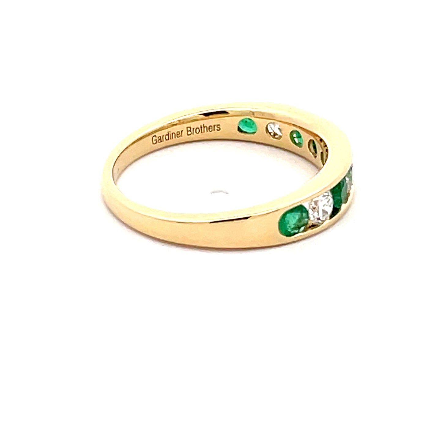 Emerald and Round Brilliant cut diamond 9 stone eternity ring Gardiner Brothers