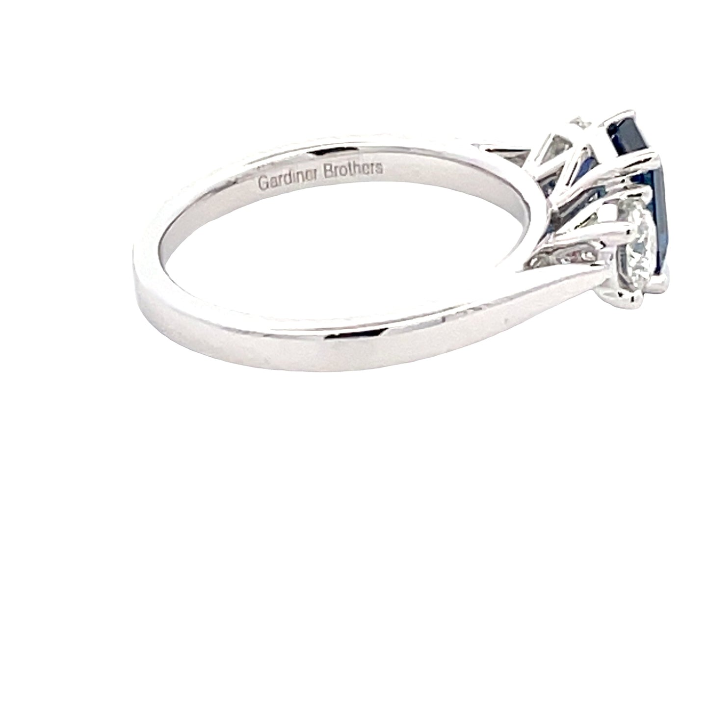 Octagonal Sapphire and round brilliant cut diamond 3 stone ring