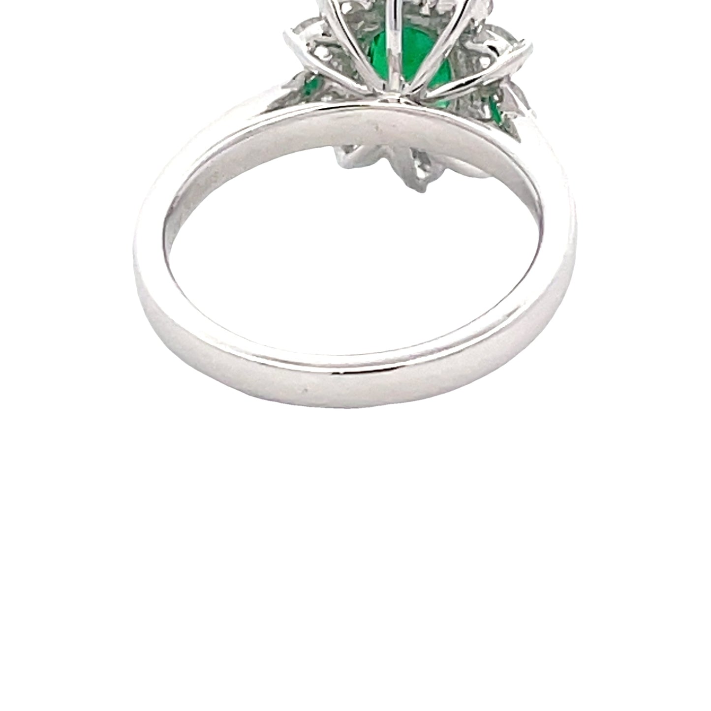 Oval Emerald and Round brilliant cut diamond cluster ring
