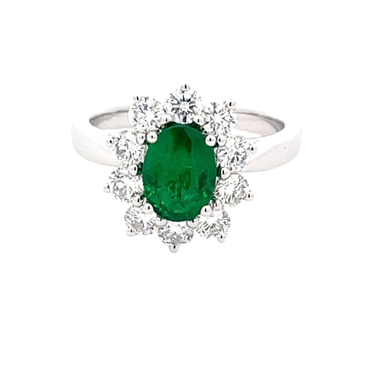Oval Emerald and Round brilliant cut diamond cluster ring