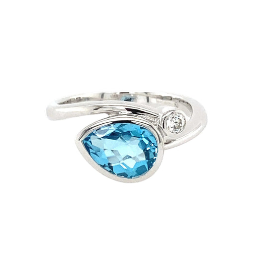 Topaz and Round Brilliant Cut Diamond Cross Over Ring Gardiner Brothers