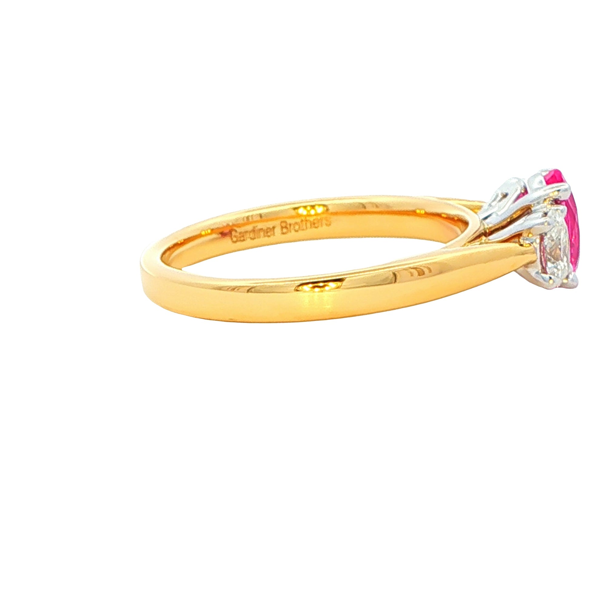 Oval shaped Pink sapphire and diamond 3 stone ring Gardiner Brothers