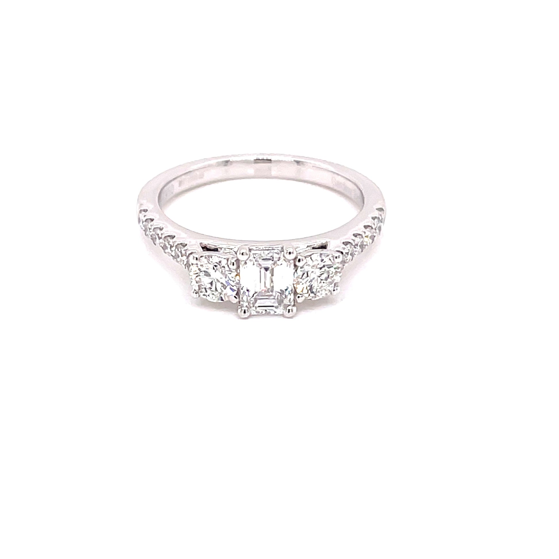 Platinum Emerald and Round Brilliant Cut Diamond 3 Stone Ring with Diamond Set Shoulders - 1.15cts Gardiner Brothers