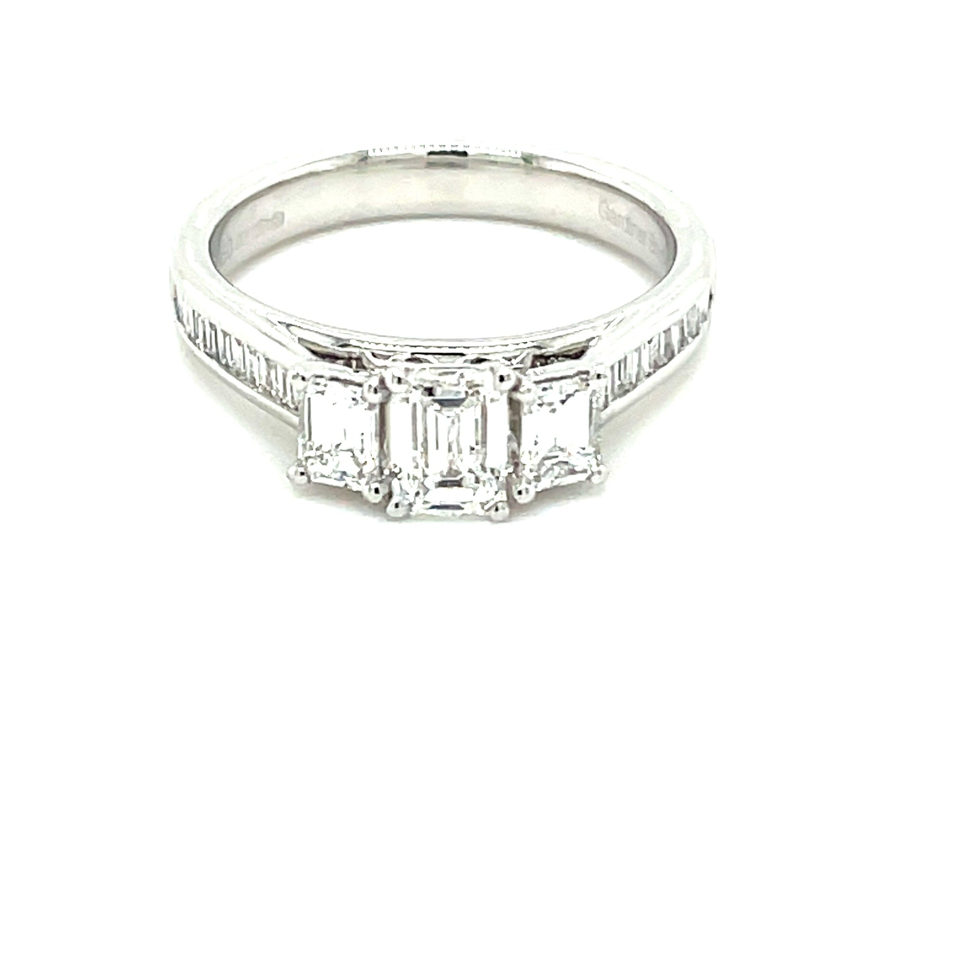 Platinum Emerald Cut Diamond 3 Stone Ring With Baguette Cut Diamond Set Shoulders - 1.20cts Gardiner Brothers