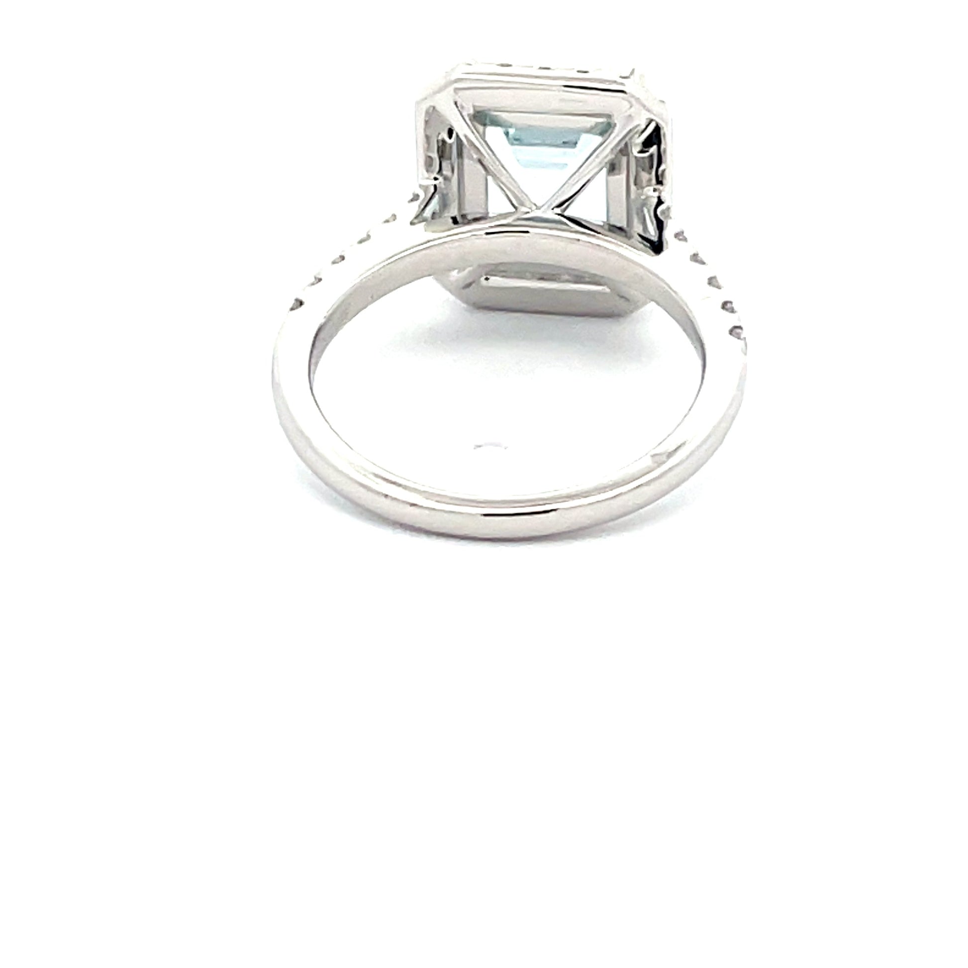 AQUAMARINE AND DIAMOND HALO STYLE RING  Gardiner Brothers   