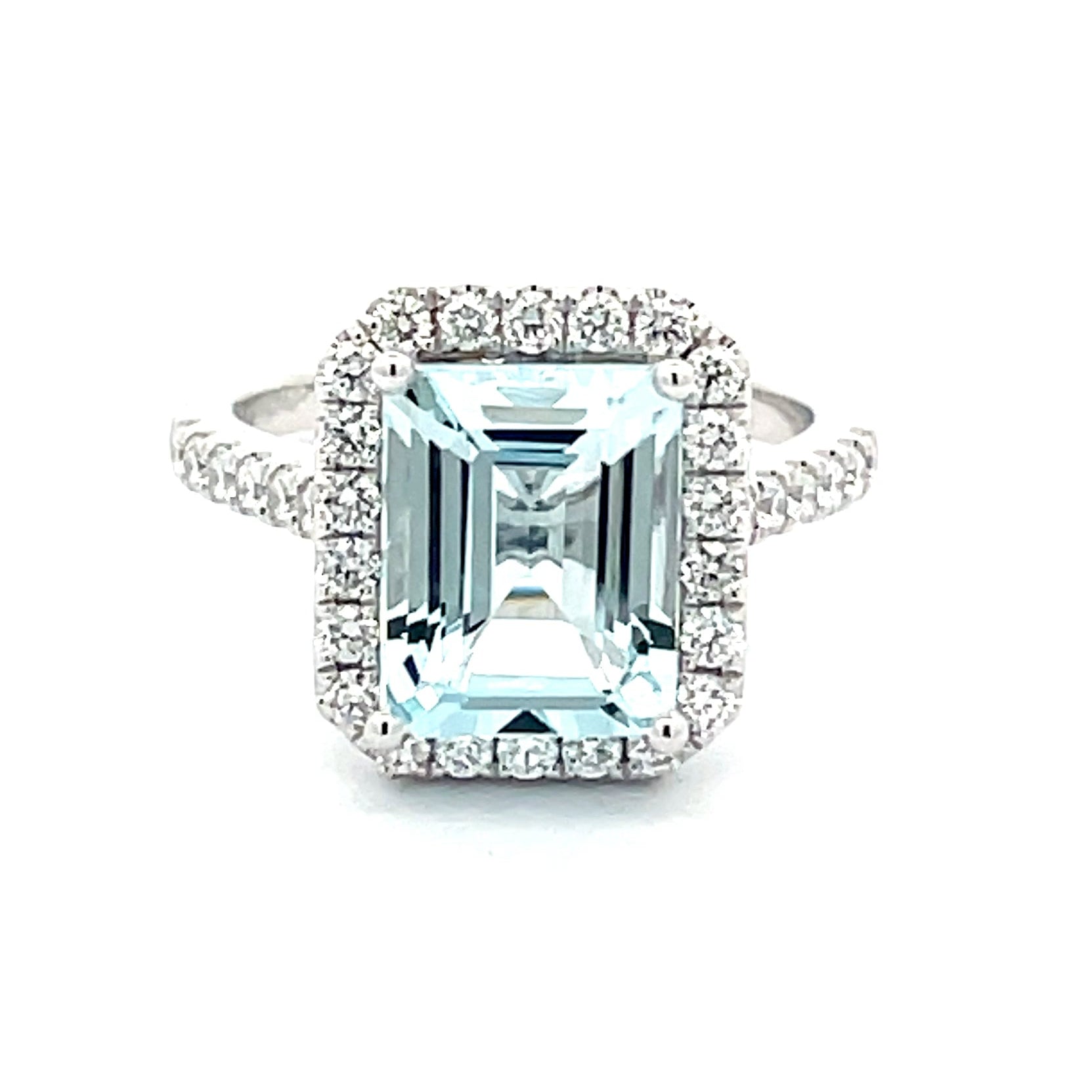 AQUAMARINE AND DIAMOND HALO STYLE RING  Gardiner Brothers   