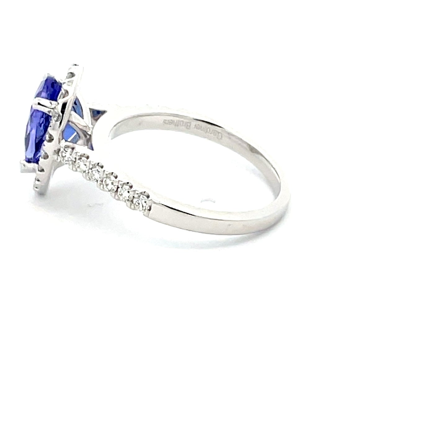 Pear Shaped Tanzanite and Diamond halo style ring Gardiner Brothers