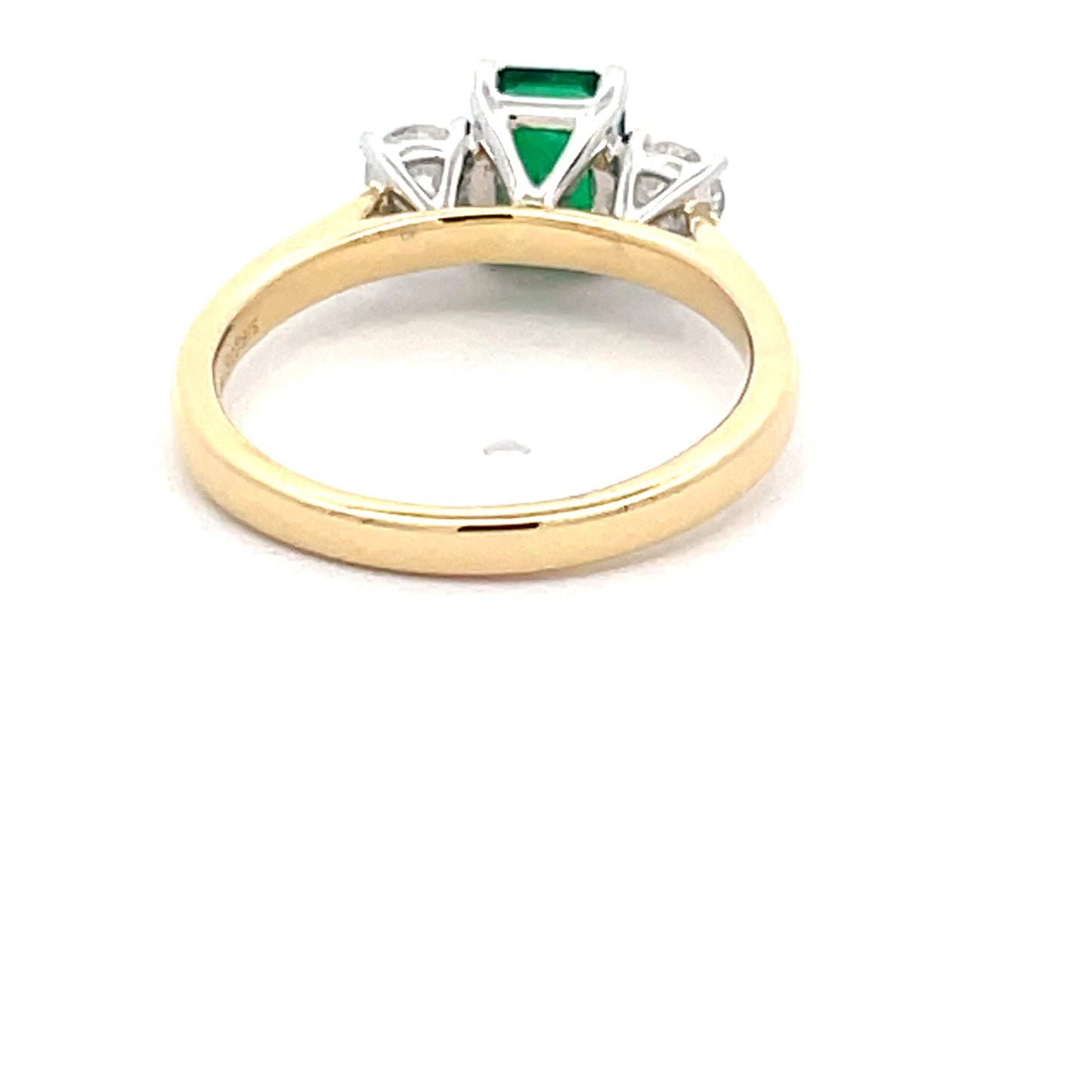 Octagonal Emerald and round brilliant cut diamond 3 stone ring  Gardiner Brothers   