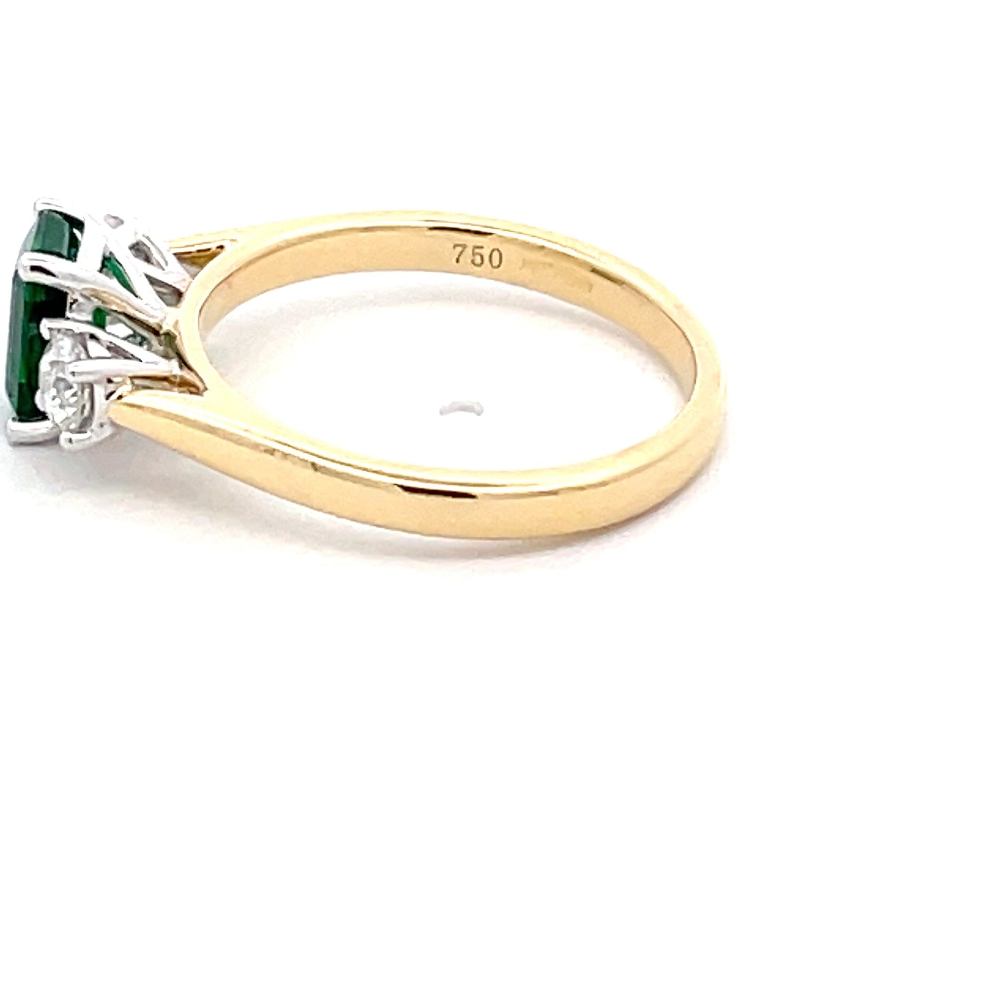 Octagonal Emerald and round brilliant cut diamond 3 stone ring  Gardiner Brothers   