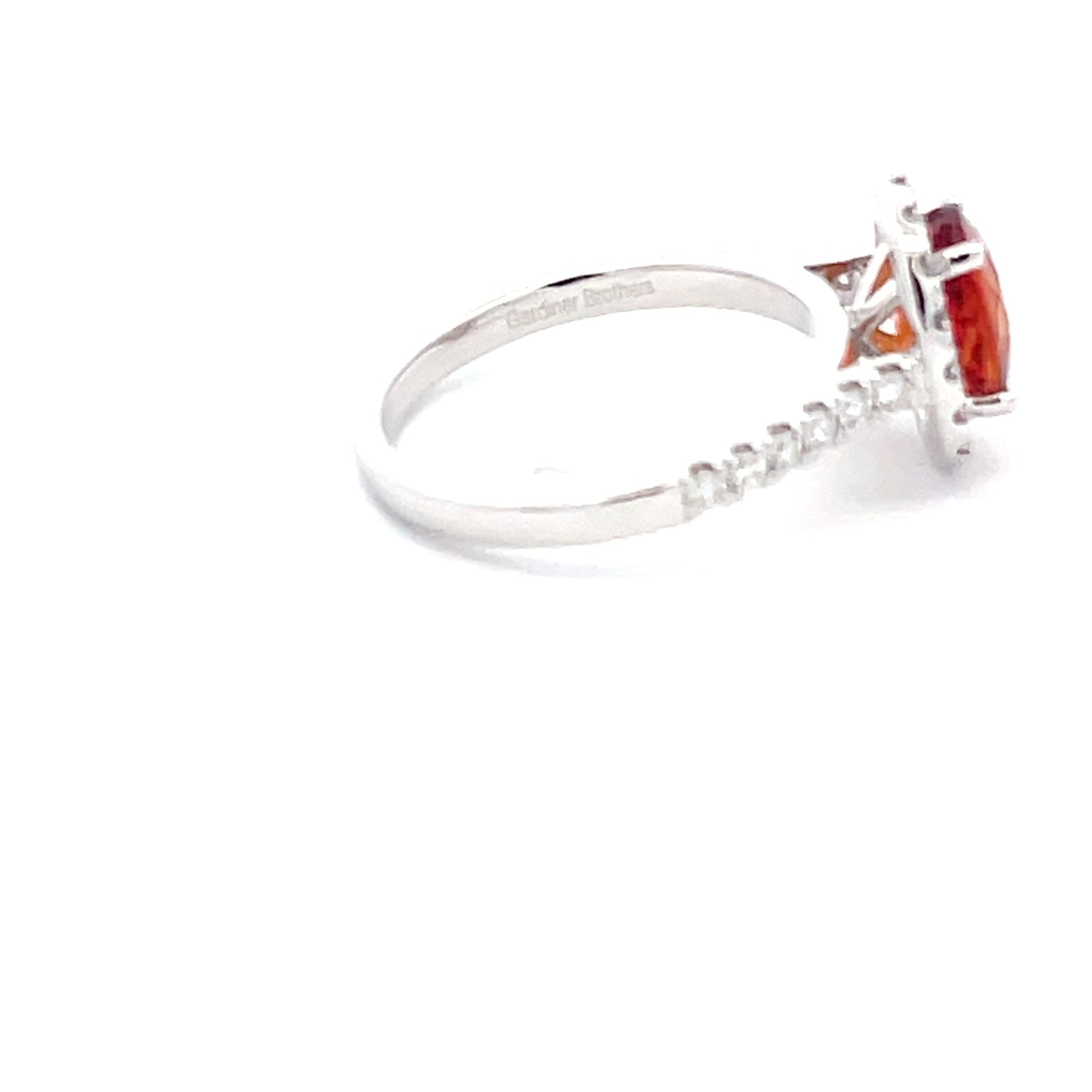 Orange Sapphire and diamond halo style ring  Gardiner Brothers   