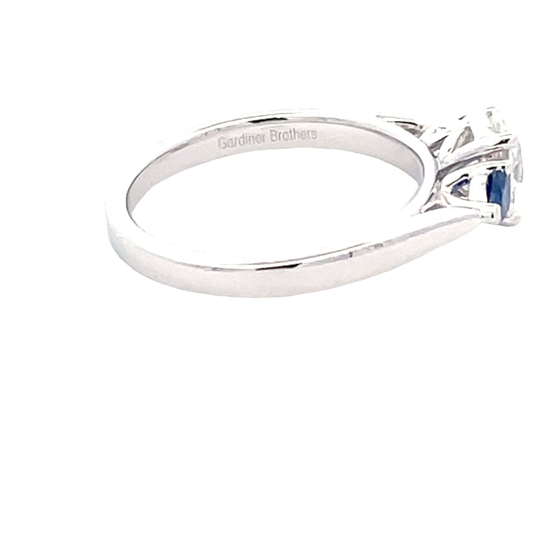 Platinum Oval Diamond and Pear Shaped Sapphire 3 Stone Ring Gardiner Brothers