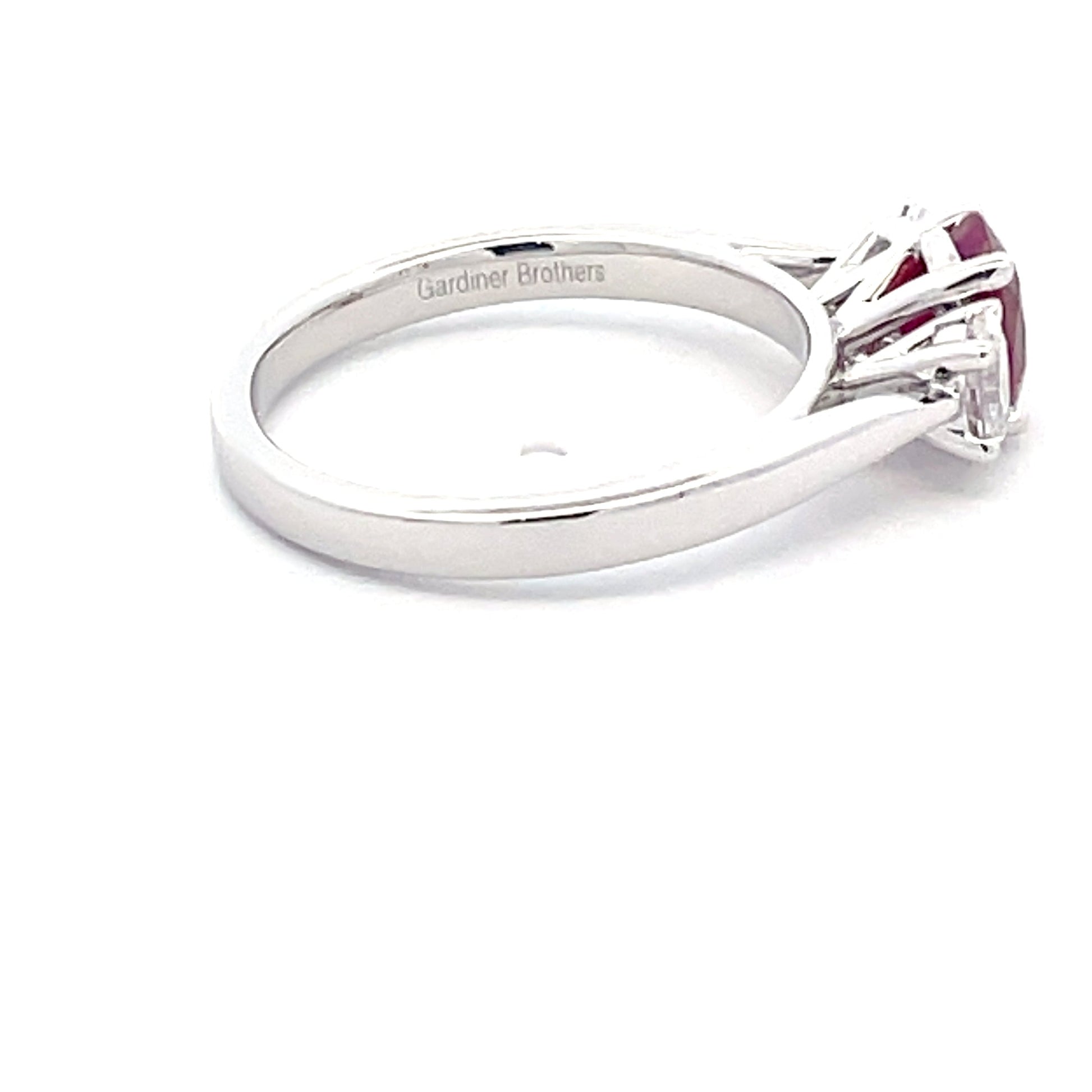 Oval Shaped ruby and round brilliant cut diamond 3 stone ring  Gardiner Brothers   