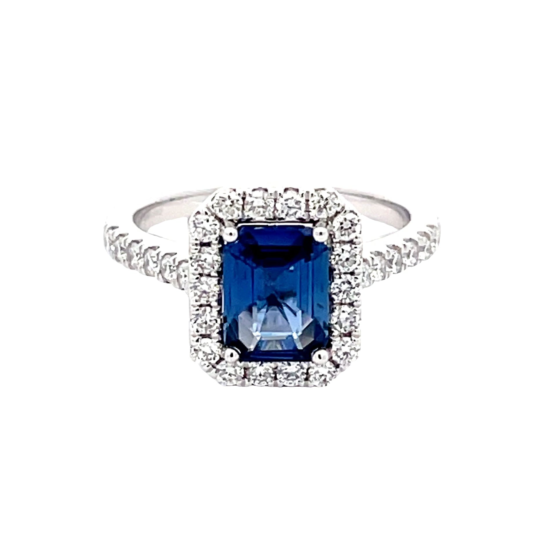 Octagonal Sapphire and round brilliant cut diamond halo cluster style ring  Gardiner Brothers   
