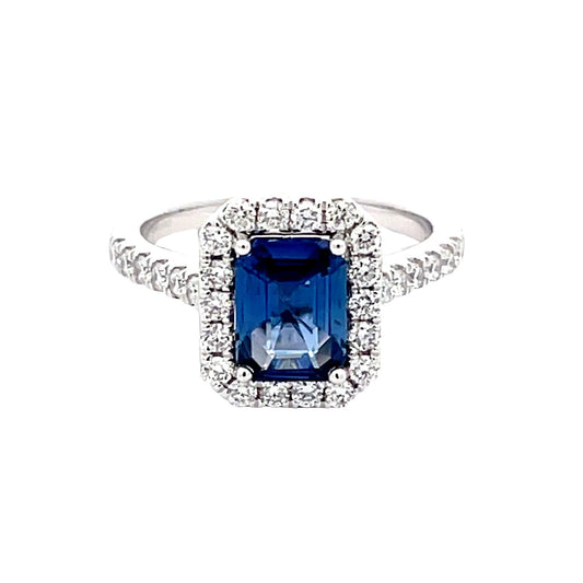 Octagonal Sapphire and round brilliant cut diamond halo cluster style ring  Gardiner Brothers   