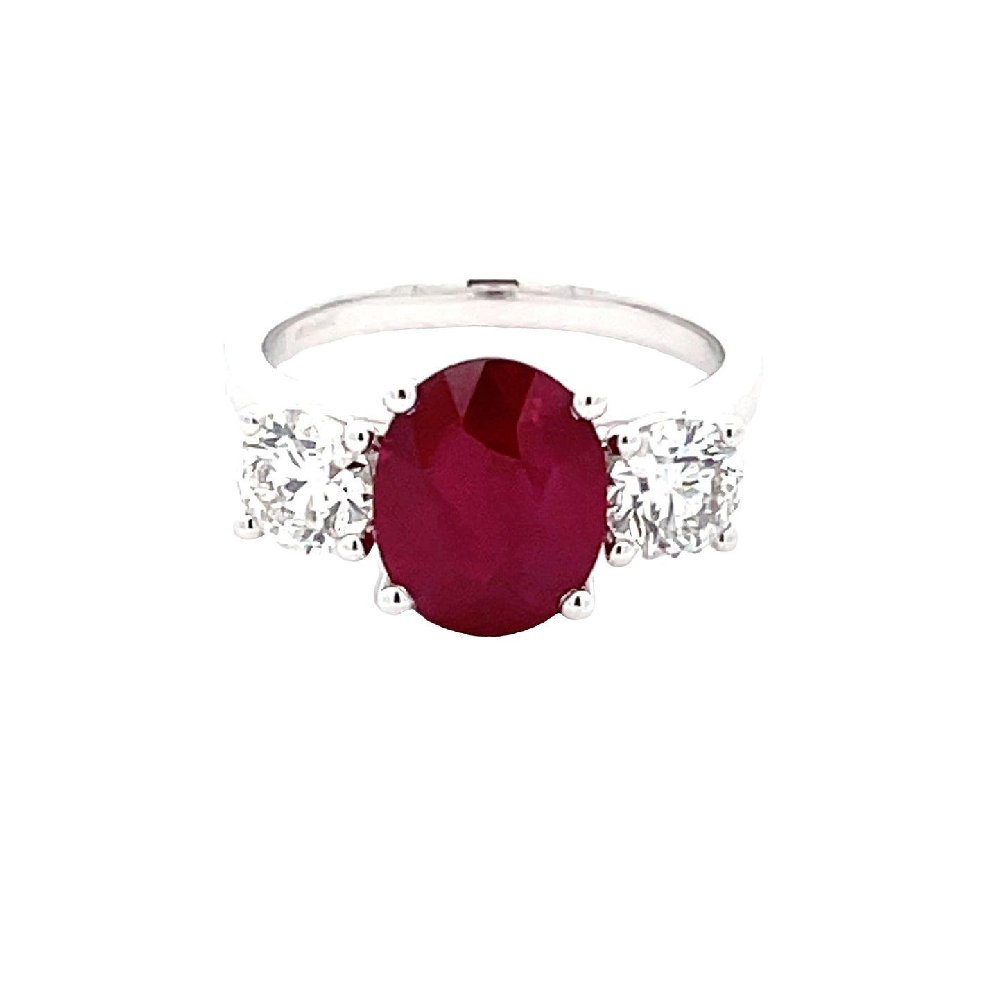 Oval Shaped Ruby and round brilliant cut diamond 3 stone ring  Gardiner Brothers   