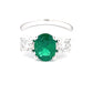 Oval Emerald and round brilliant cut diamond 3 stone ring  Gardiner Brothers   