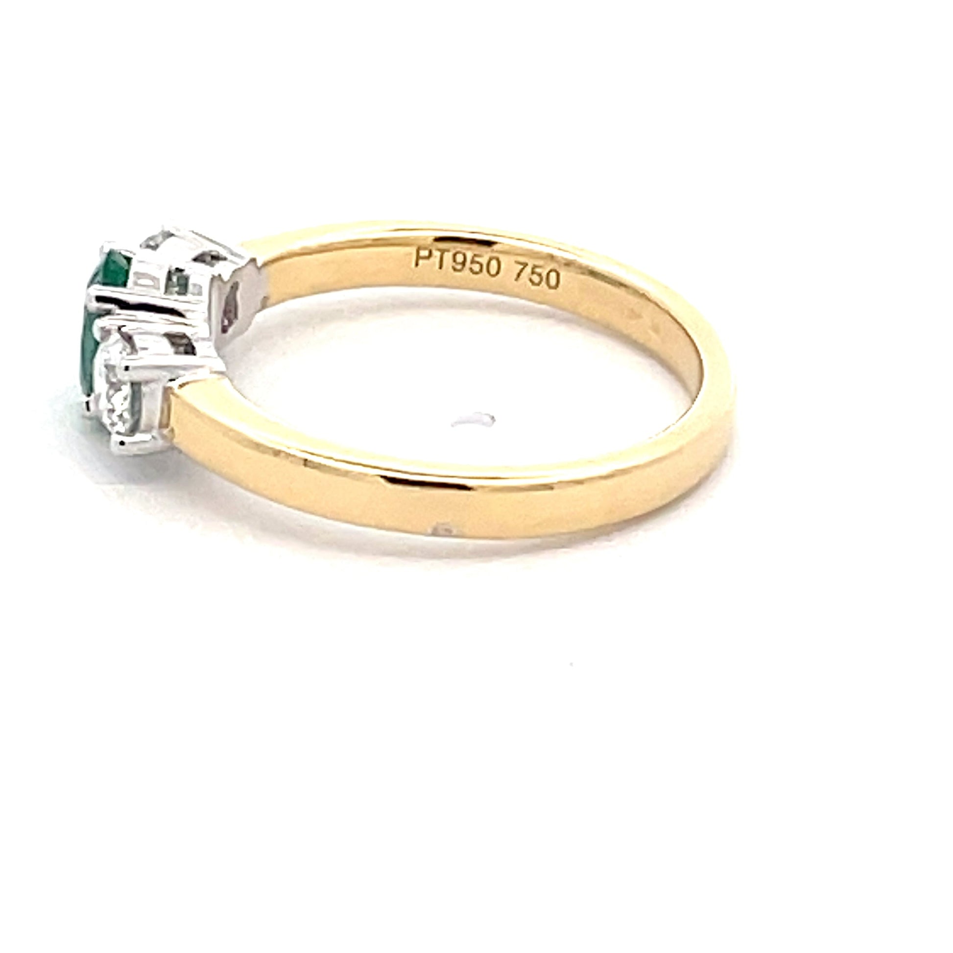 Oval emerald and round brilliant cut diamond 3 stone ring  Gardiner Brothers   