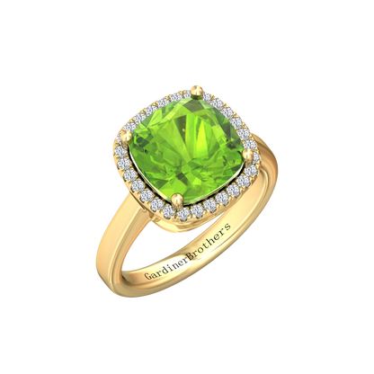 Nova cushion shaped Peridot ring with a halo of diamonds Gardiner Brothers Yellow Gold
