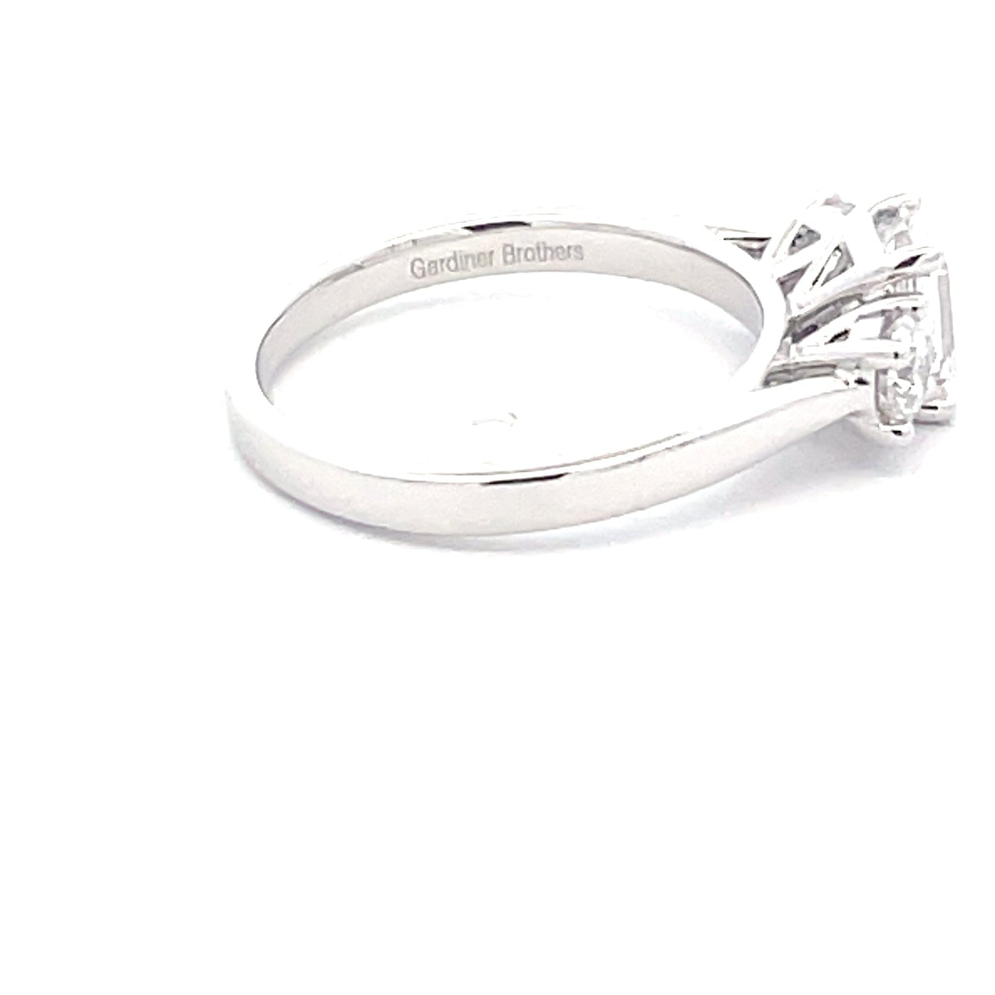 Platinum Emerald and round brilliant cut diamond 3 stone ring - 1.50cts Gardiner Brothers