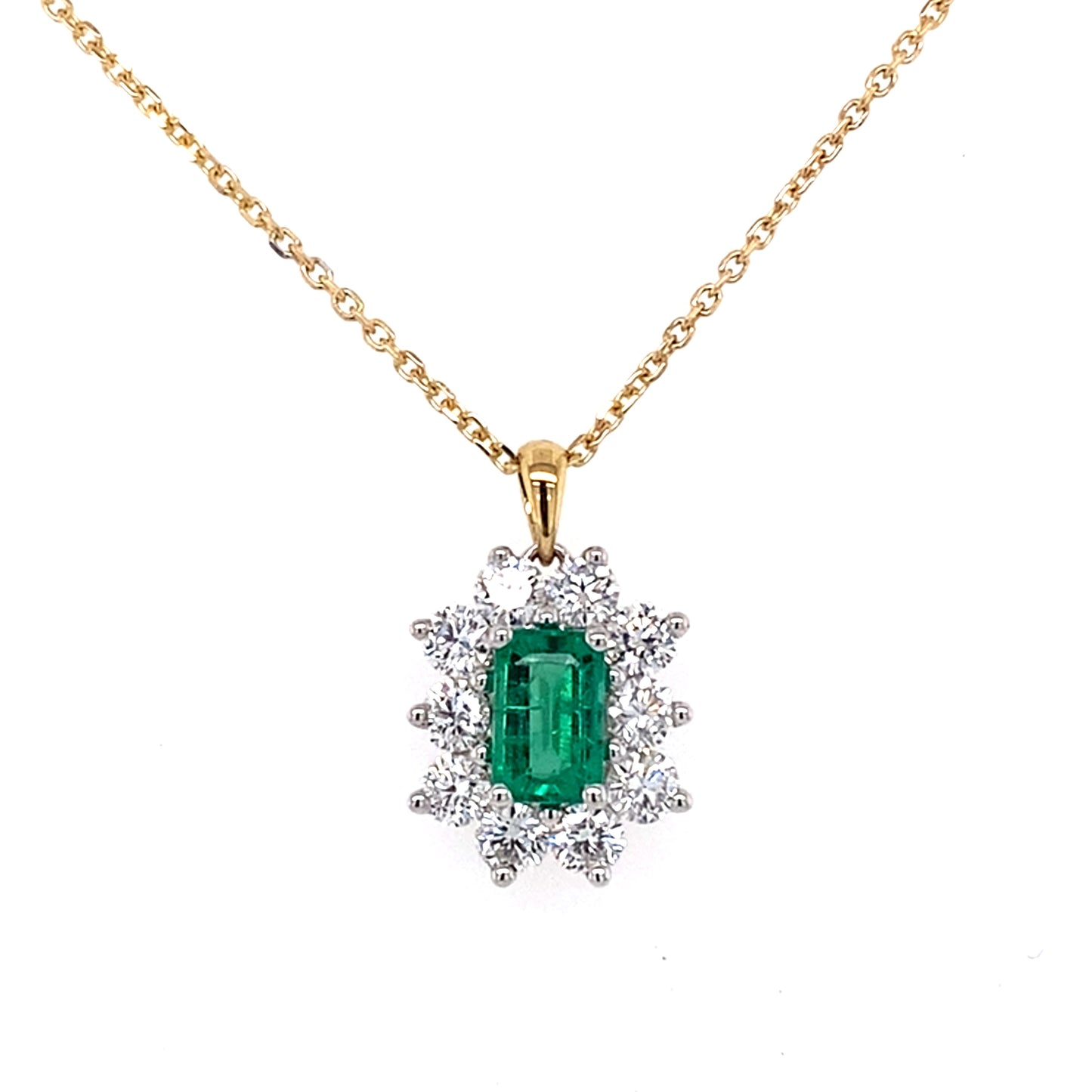 Octagonal emerald and round brilliant cut diamond cluster pendant  Gardiner Brothers   