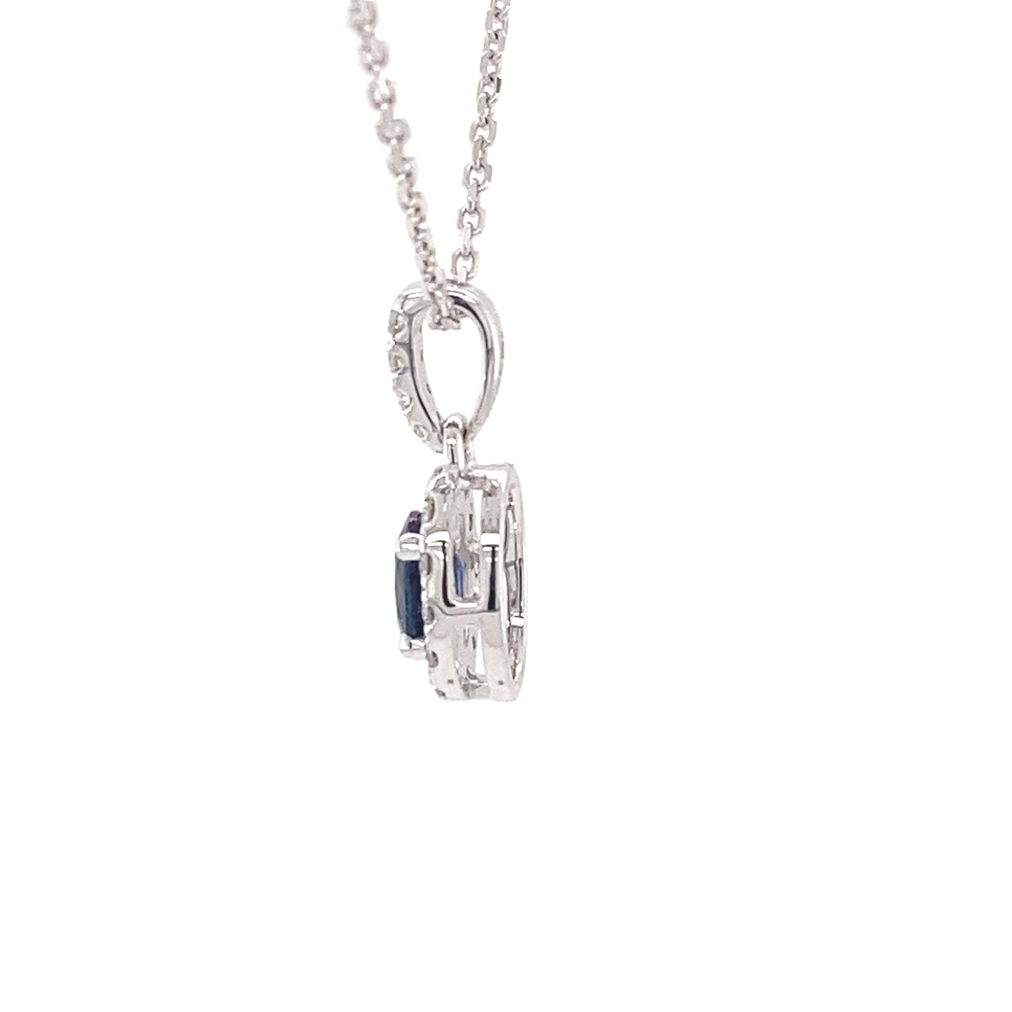 Oval sapphire and round brilliant cut diamond halo style pendant  Gardiner Brothers   