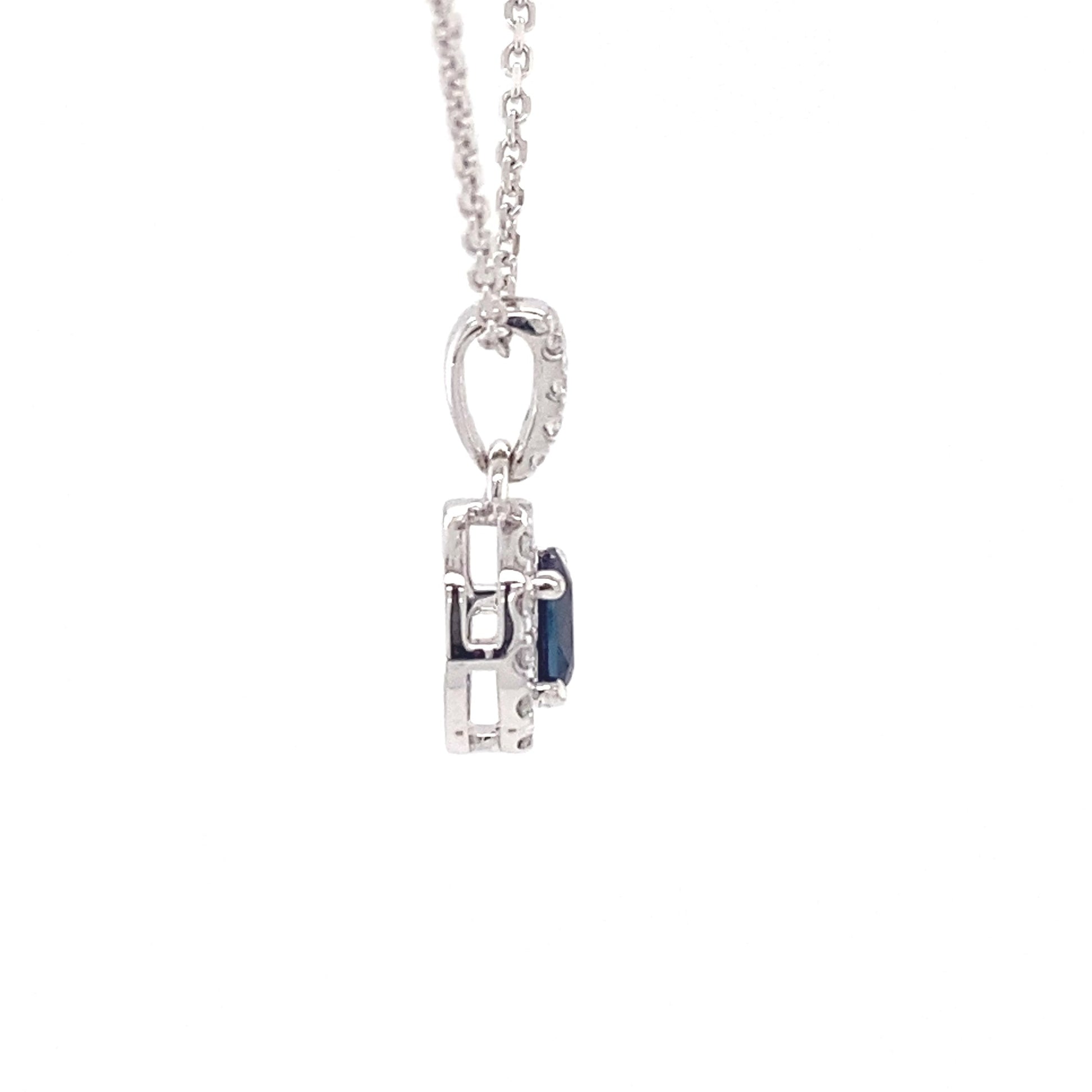 Oval sapphire and round brilliant cut diamond halo style pendant  Gardiner Brothers   