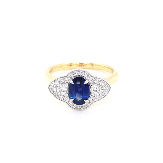 Oval Sapphire and round brilliant cut diamond fancy halo style ring Gardiner Brothers