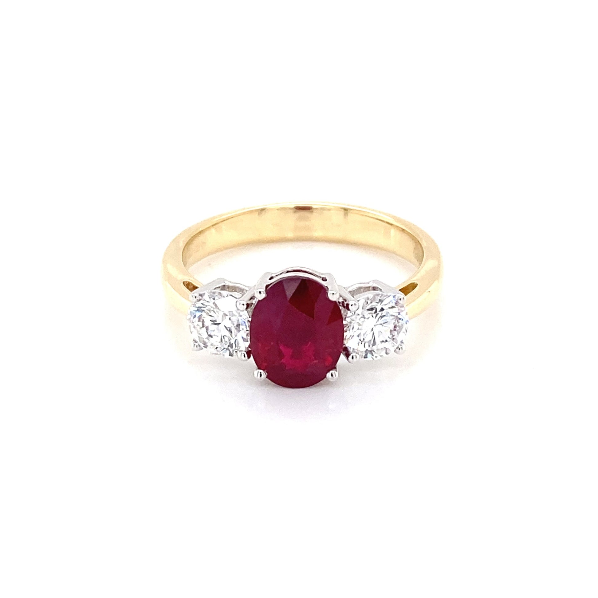 Oval Shaped Ruby and round brilliant cut diamond 3 stone ring Gardiner Brothers