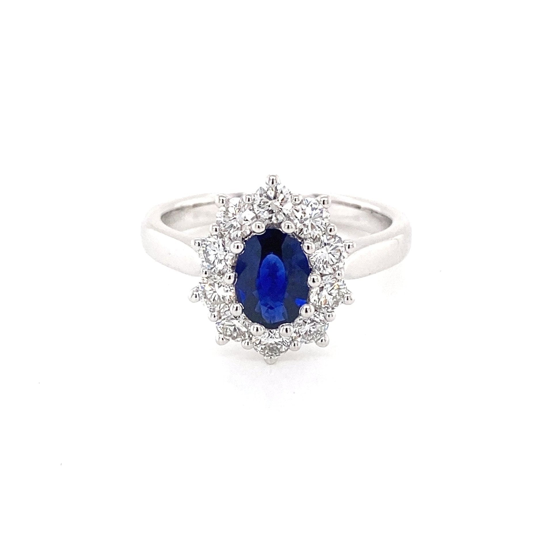 Oval shaped sapphire and round brilliant cut diamond cluster ring Gardiner Brothers