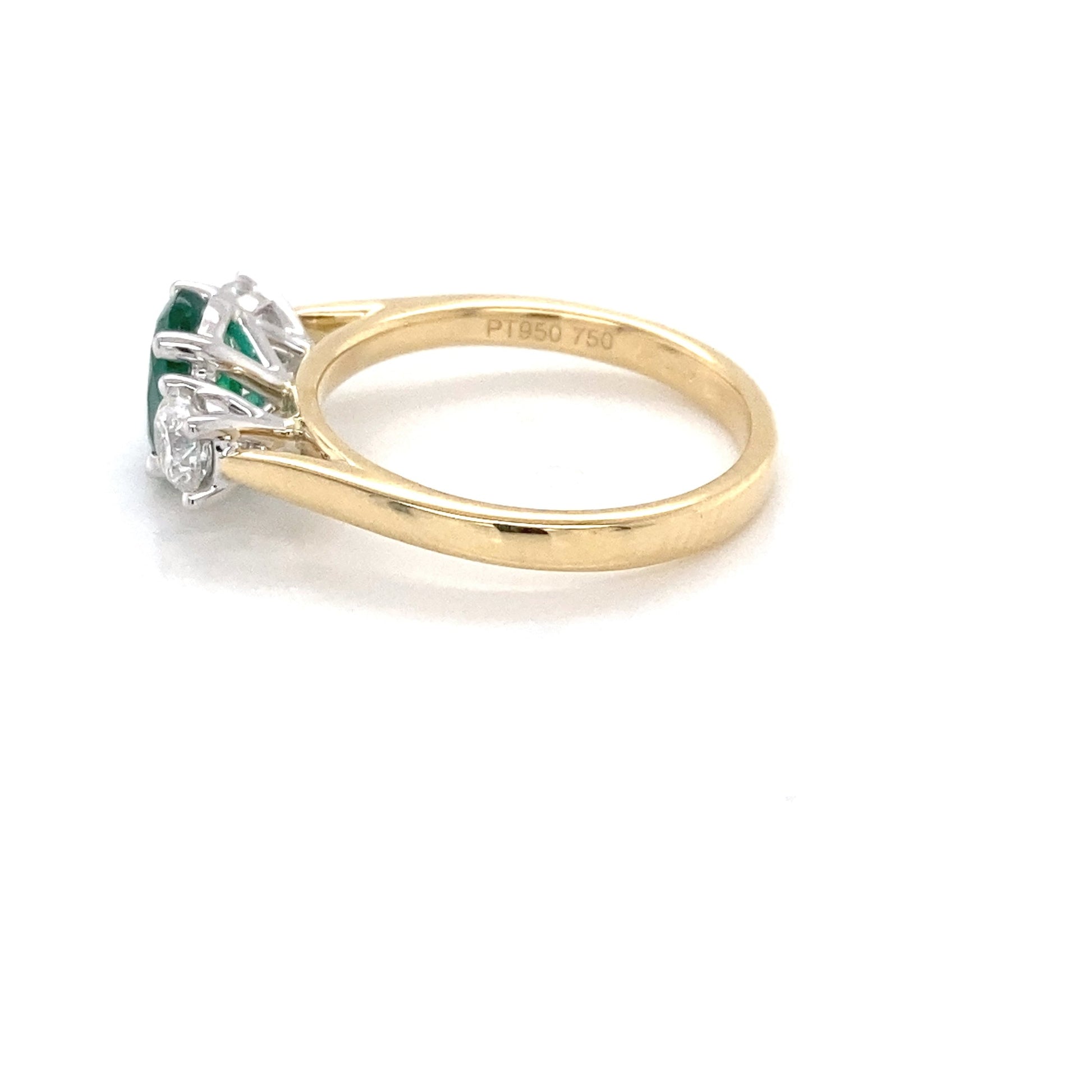 Oval Shaped Emerald and round brilliant cut diamond 3 stone ring Gardiner Brothers