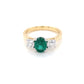 Oval Shaped Emerald and round brilliant cut diamond 3 stone ring Gardiner Brothers