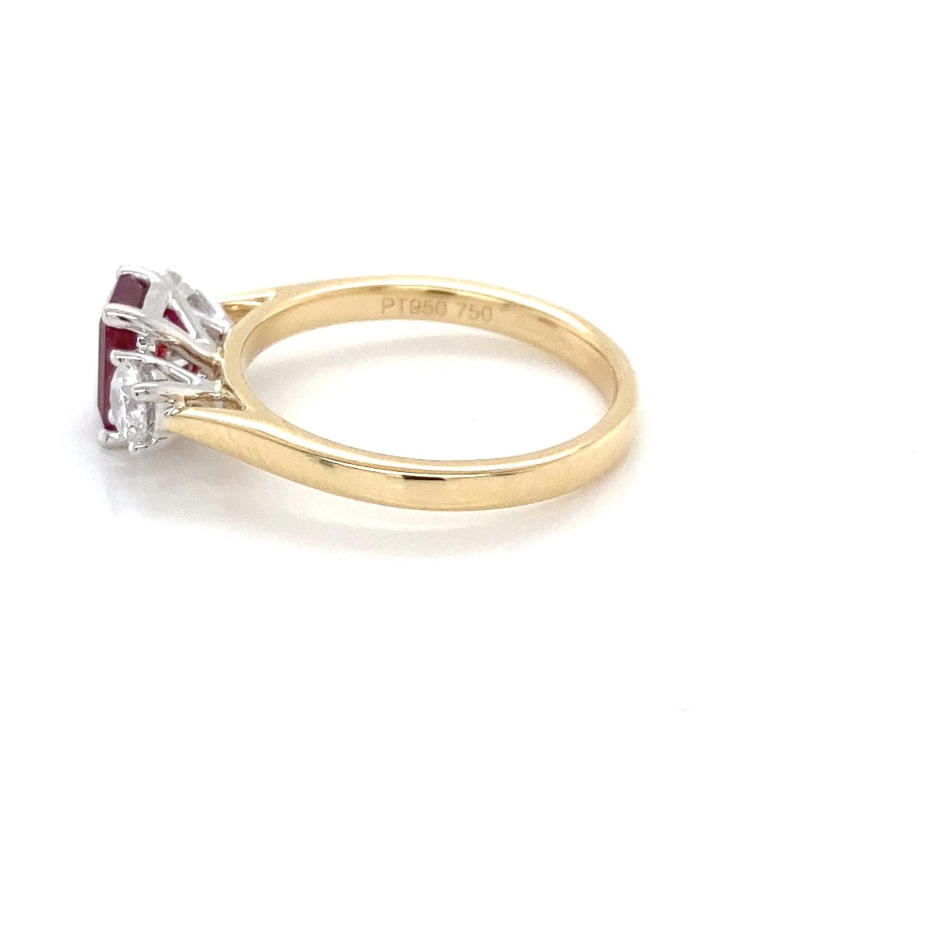 Octagonal Ruby and round brilliant cut diamond 3 stone ring Gardiner Brothers