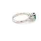 Octagonal shaped emerald and round brilliant cut diamond 3 stone ring Gardiner Brothers