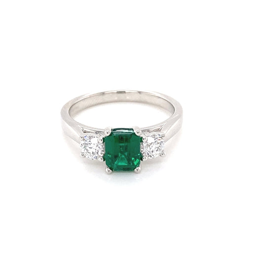 Octagonal shaped emerald and round brilliant cut diamond 3 stone ring Gardiner Brothers