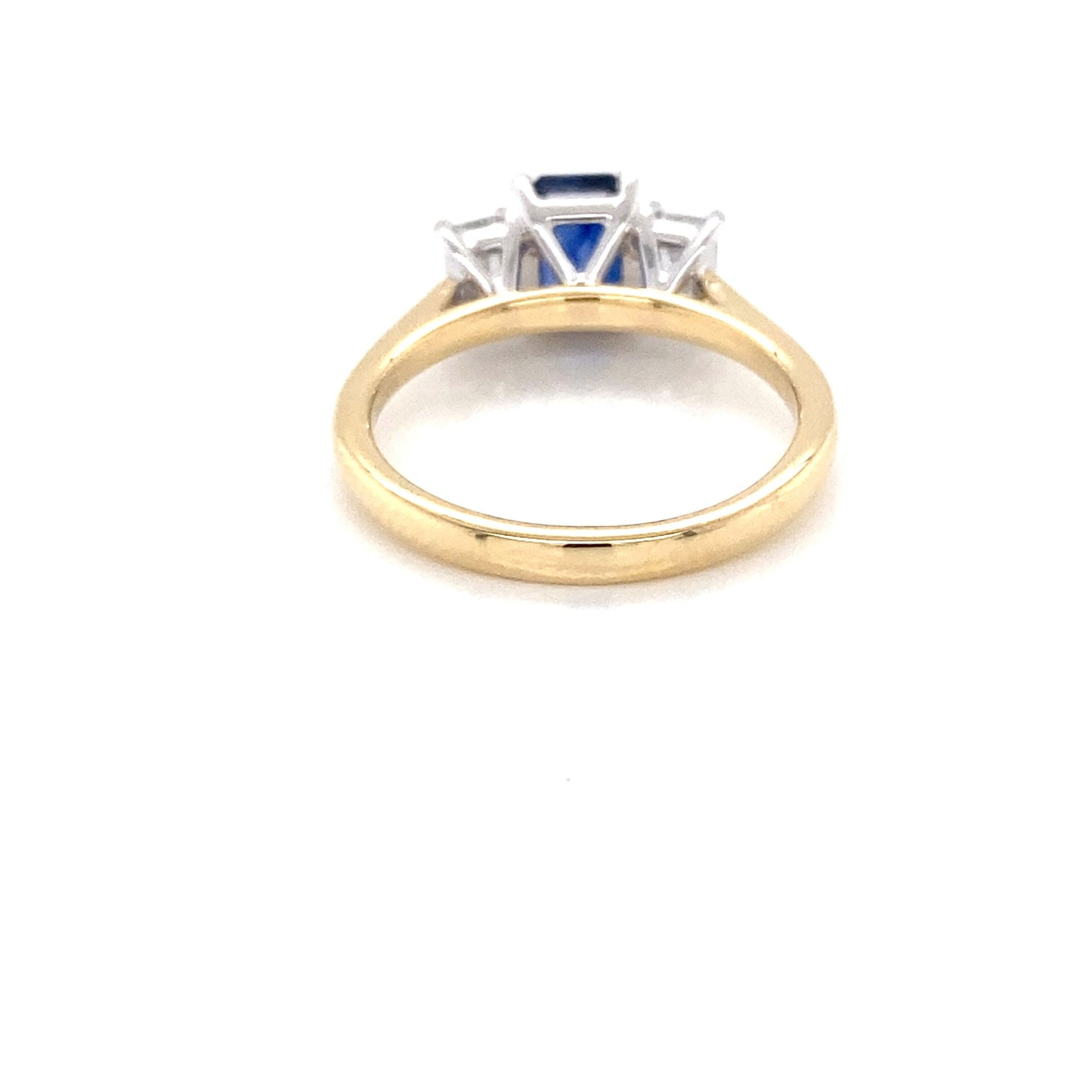 Octagonal shaped sapphire and emerald cut diamond 3 stone ring Gardiner Brothers