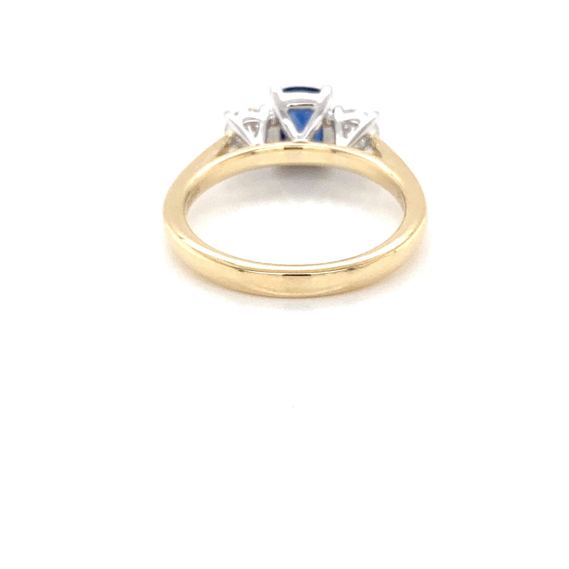 Cushion Shaped Sapphire and round brilliant cut diamond 3 stone ring Gardiner Brothers