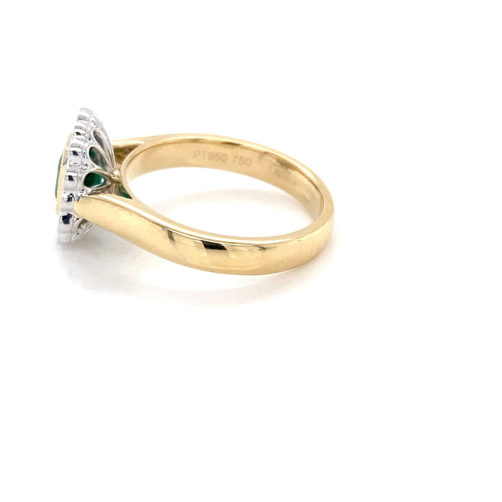 Octagonal Emerald and round brilliant cut diamond vintage cluster style ring Gardiner Brothers