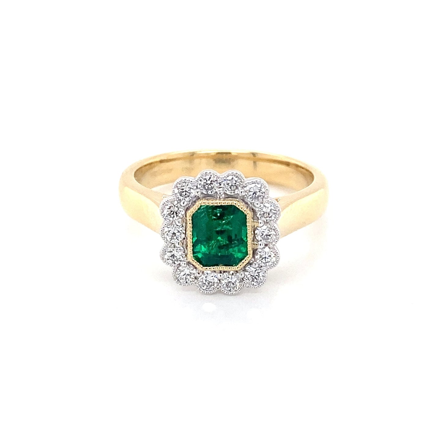 Octagonal Emerald and round brilliant cut diamond vintage cluster style ring Gardiner Brothers