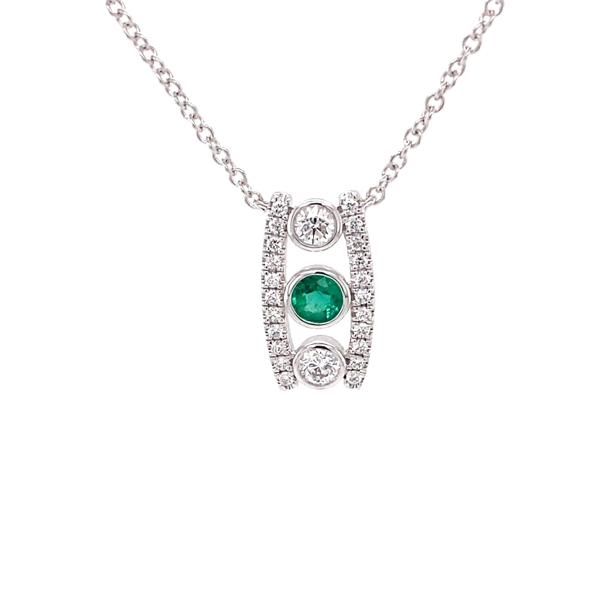 Emerald and round brilliant cut diamond drop style pendant Gardiner Brothers