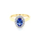 Oval Shaped Tanzanite and round brilliant cut diamond halo ring Gardiner Brothers