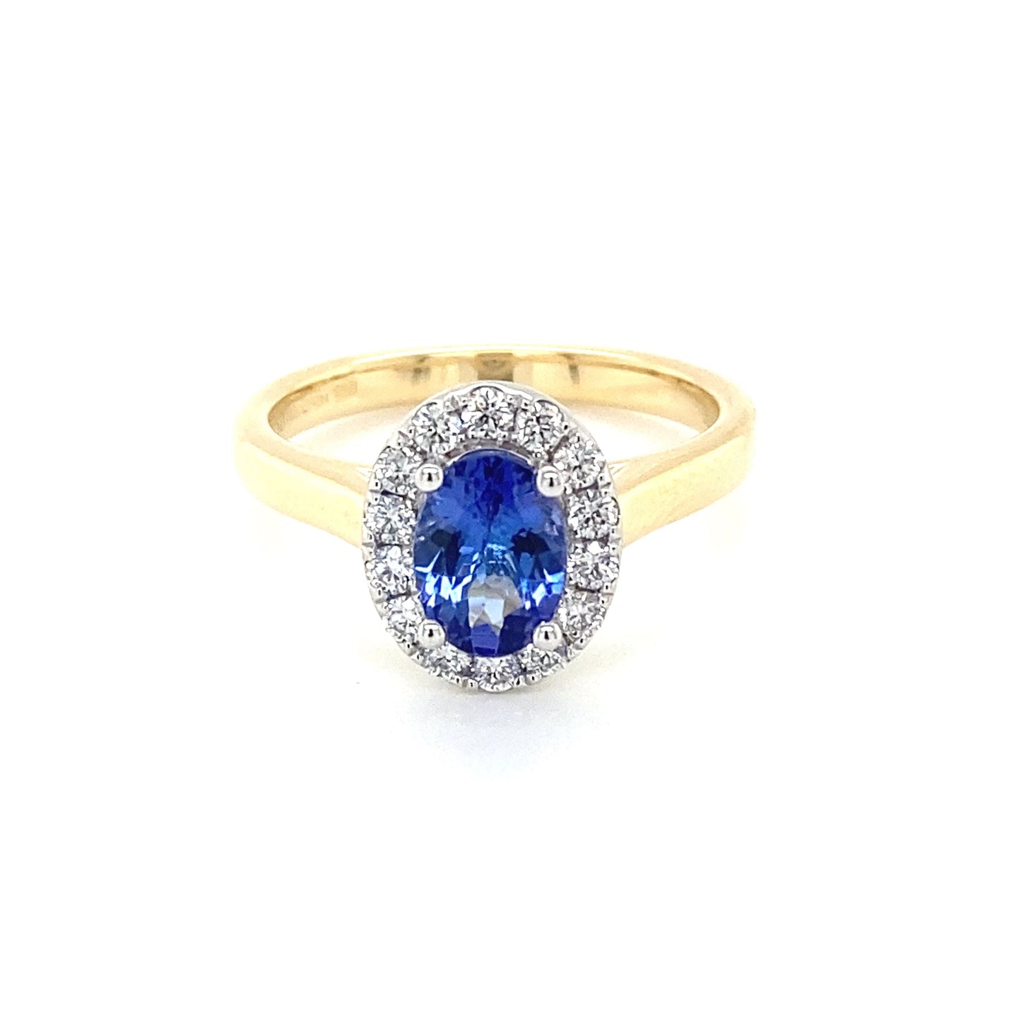 Oval Shaped Tanzanite and diamond halo ring Gardiner Brothers