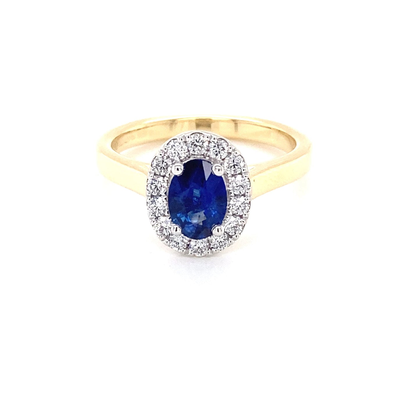 Oval Shaped Sapphire and round brilliant cut diamond halo ring Gardiner Brothers