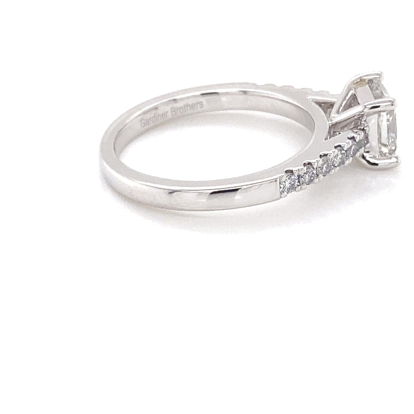 Platinum Princess cut diamond solitaire ring with round brilliant cut diamond set shoulders - 1.17cts Gardiner Brothers