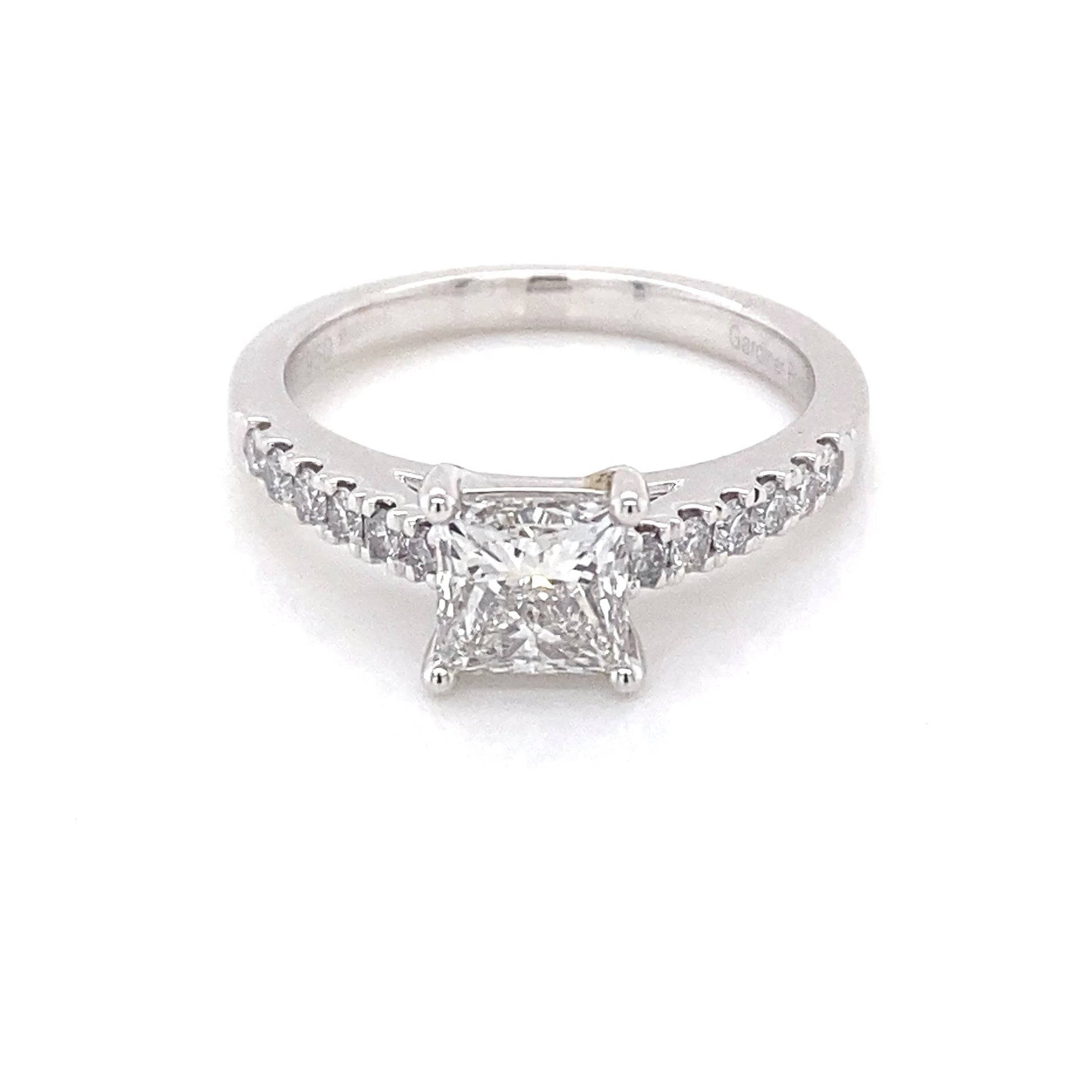 Platinum Princess cut diamond solitaire ring with round brilliant cut diamond set shoulders - 1.17cts Gardiner Brothers