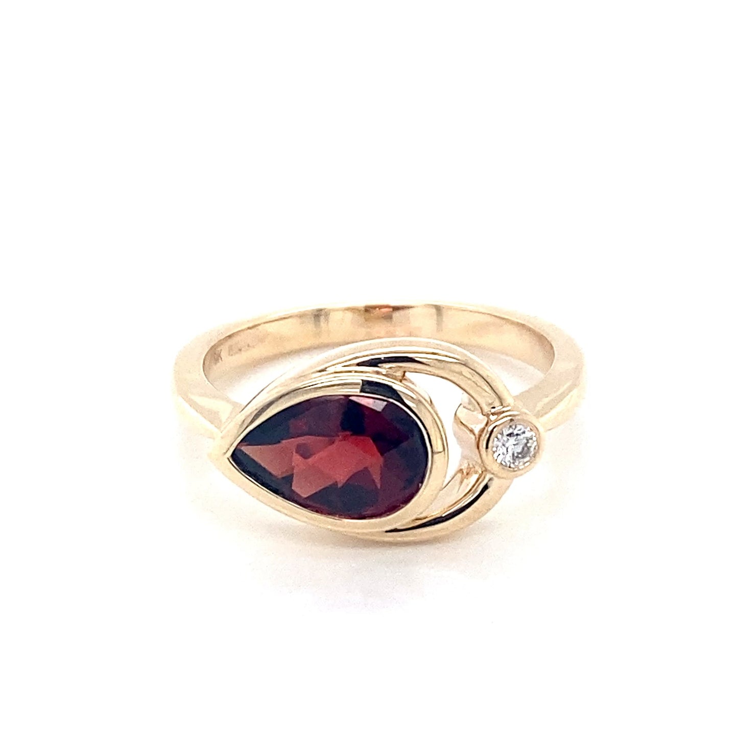 Pear shaped Garnet and round brilliant cut diamond ring Gardiner Brothers