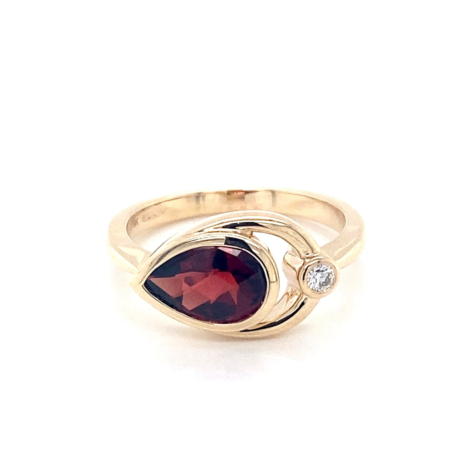 Pear shaped Garnet and round brilliant cut diamond ring Gardiner Brothers